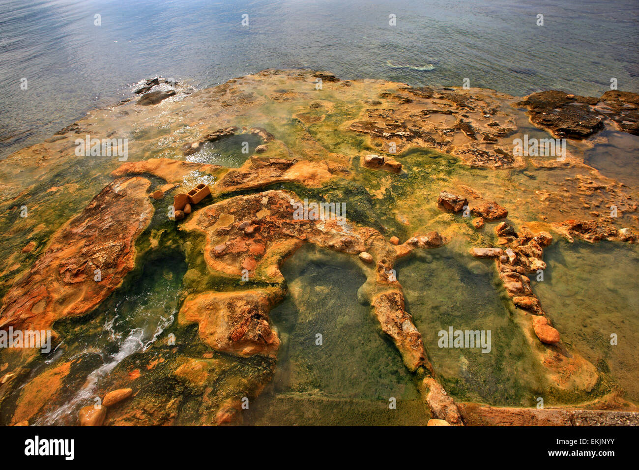 Small natural pools with water from the hot springs ext to the sea, Edipsos, North Evia island, Greece. Stock Photo