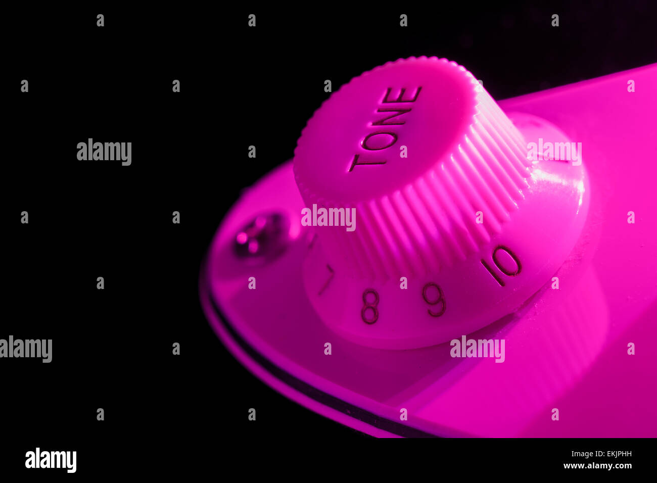Electric guitar tone knob in purple light Stock Photo Alamy