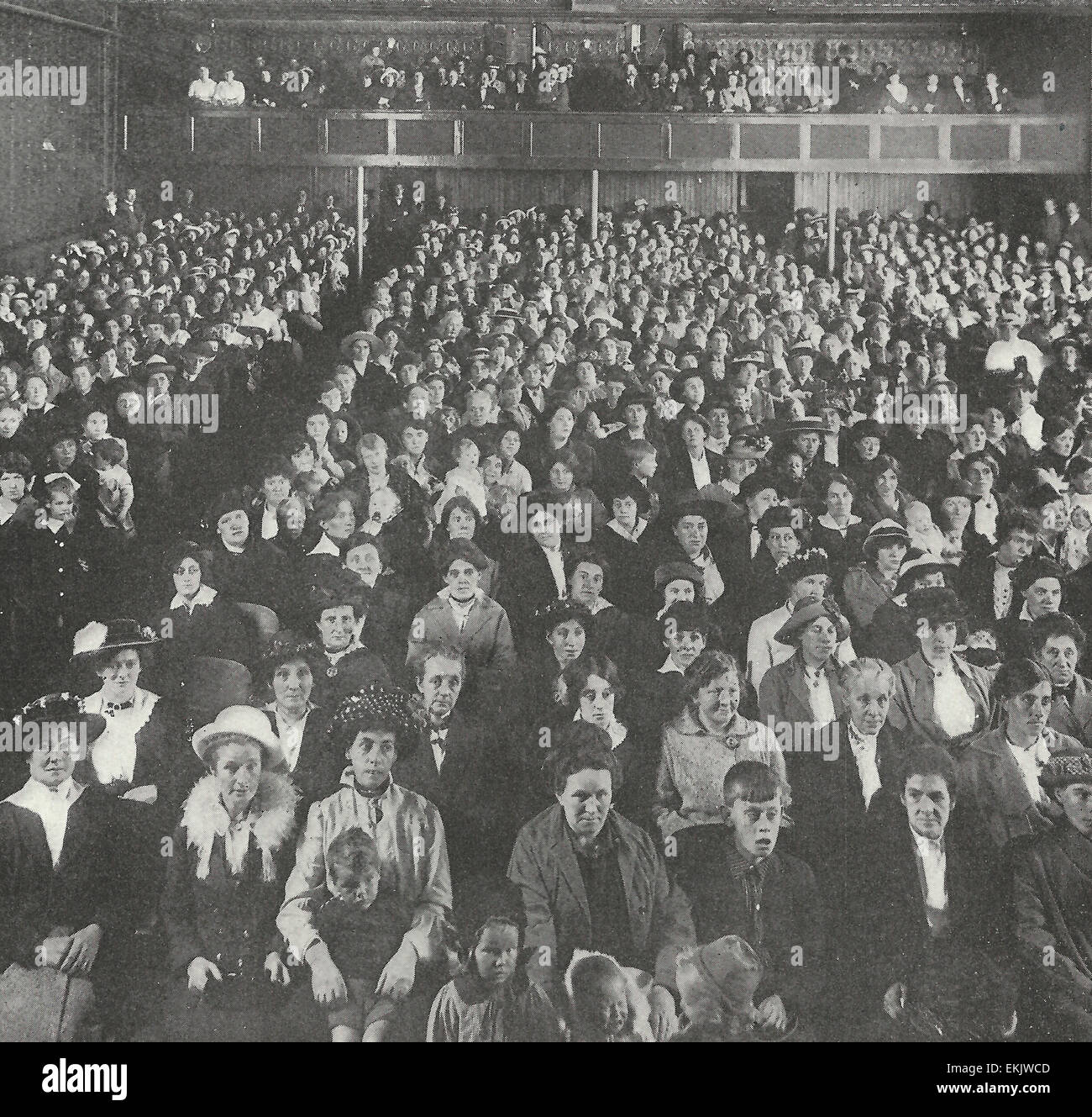 Wives and dependents of enlisted soldiers whose government allowances are being supplemented by bi-monthly payments from the Canadian Patriotic Fund, gathered in the Bijou Theatre, Edmonton, to hear an address by Sir Herbert Ames, the active head of the fund. 1916 Stock Photo
