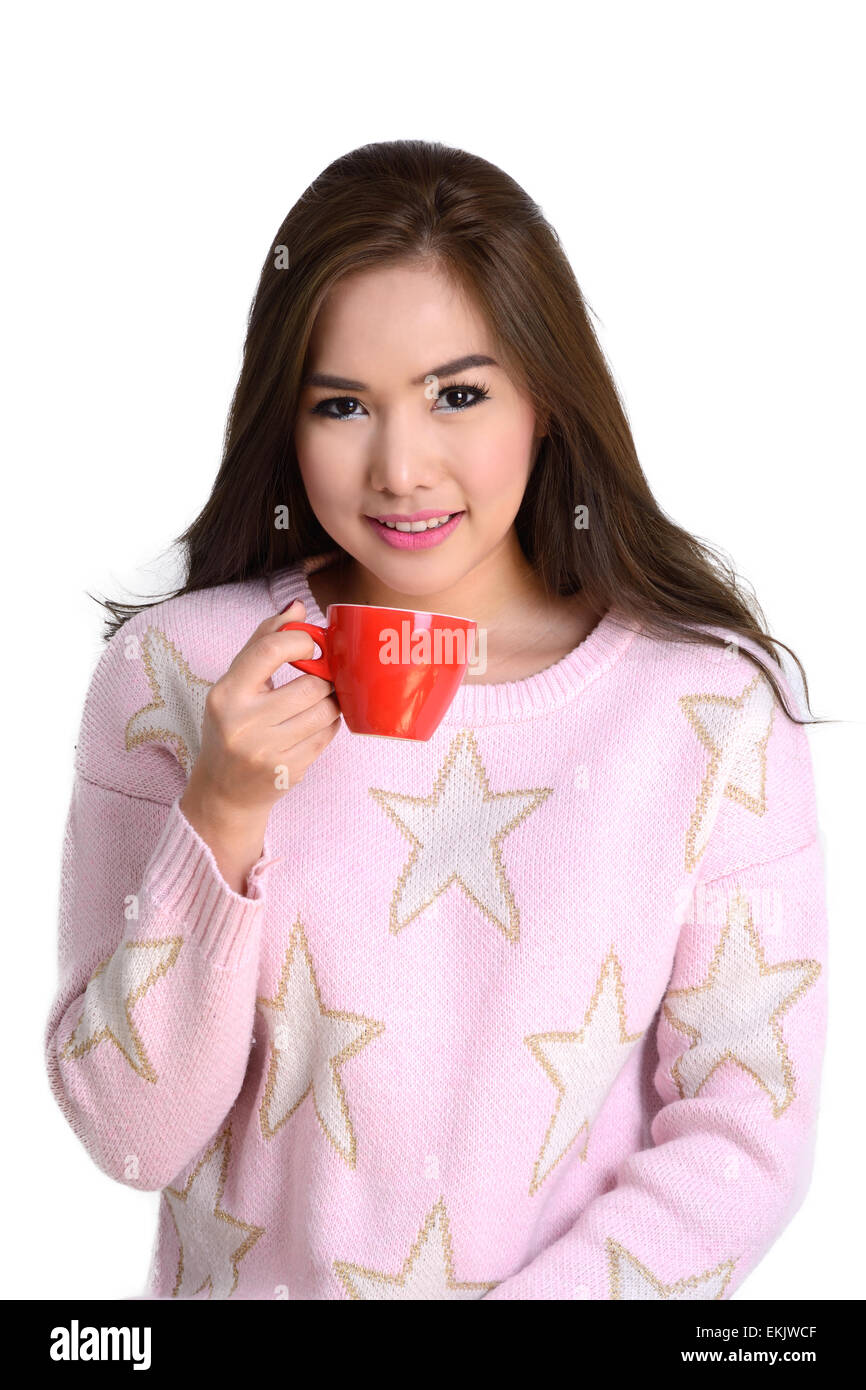 Beautiful girl with red coffee cup in her hand look so bright and feeling fresh on white background. Stock Photo