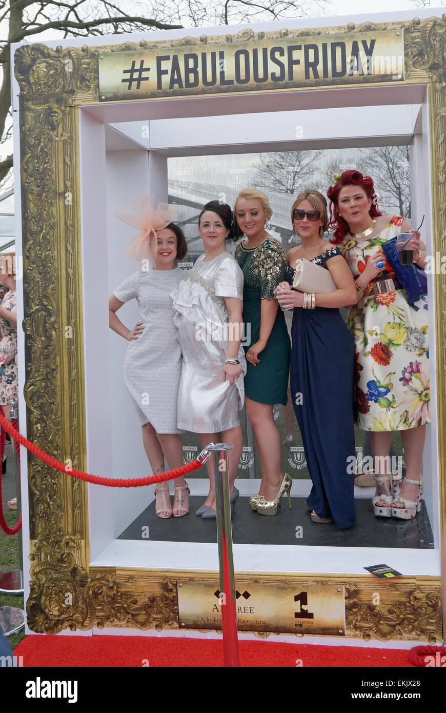 Liverpool, UK. 10th Apr, 2015. Racegoers enjoy Ladies Day At Aintree - Crabbie's Grand National 2015. The sunshine on Friday attracted a large crowd of spectators dressed up to the Grand national meeting on ladies Day Credit:  Pak Hung Chan/Alamy Live News Stock Photo