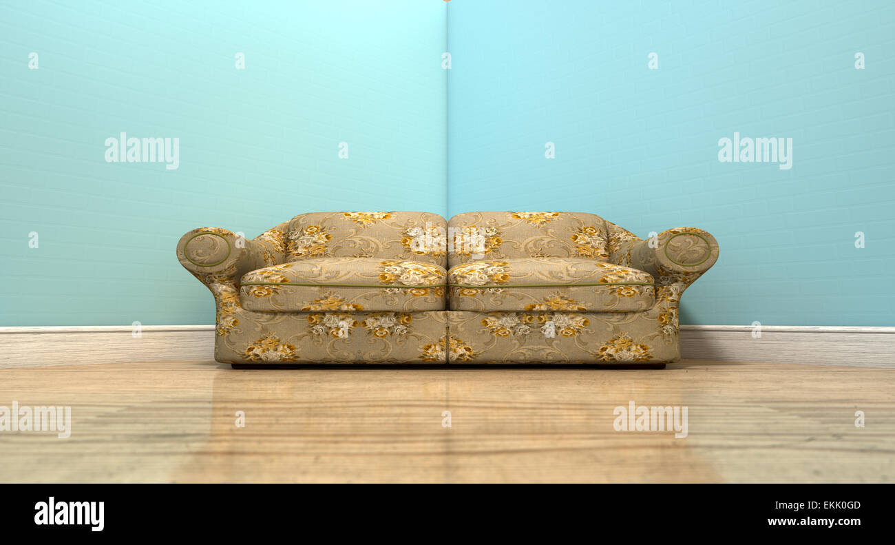 An old vintage sofa with a floral fabric in the corner of an empty room with light blue wall and a reflective wooden floor Stock Photo
