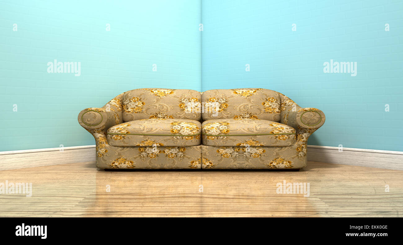 An old vintage sofa with a floral fabric in the corner of an empty room with light blue wall and a reflective wooden floor Stock Photo