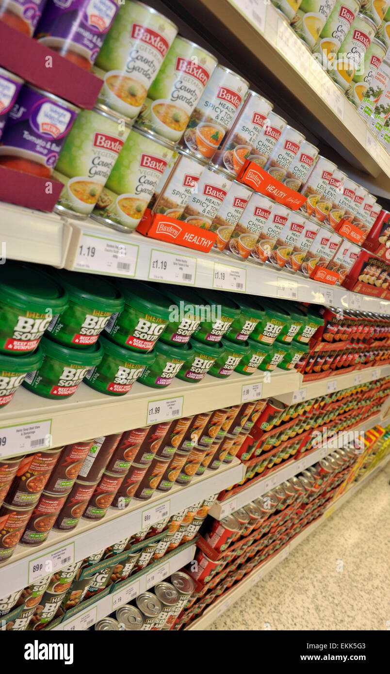 Canned food shelves in a supermarket. Stock Photo