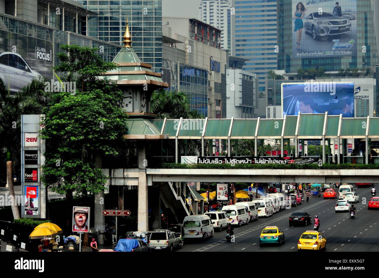 Bangkok, Thailand:  A covered bridge for pedestrians spans busy Thanon Ratchaprasong at the Central World Shopping center Stock Photo