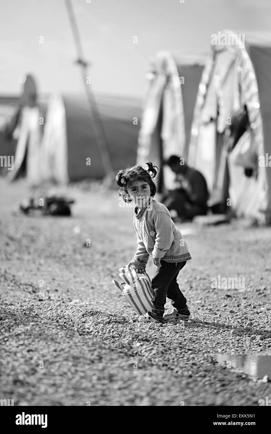 Syrian people in refugee camp in Suruc. These people are refugees from Kobane and escaped because of Islamic state attack. 3.4.2 Stock Photo