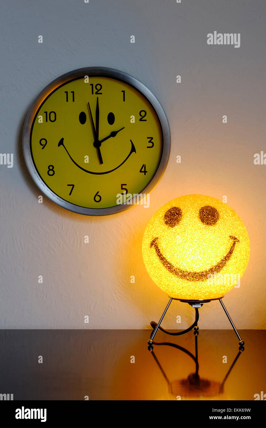 smiley clock with the time being set at two in the morning as british summer time begins Stock Photo