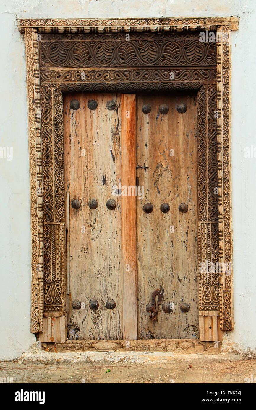 Antique, hand crafted wooden door, Stone Town, Zanzibar Stock Photo