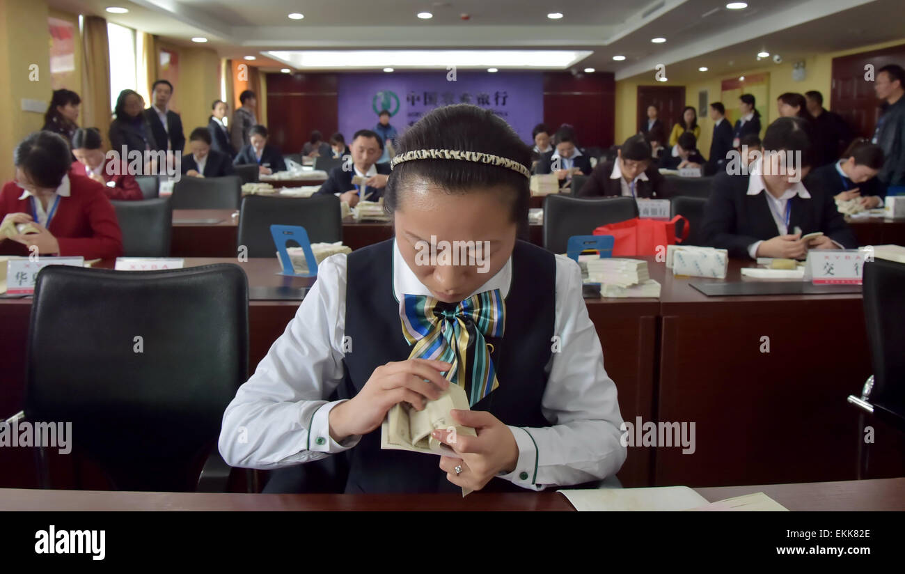 A Female Bank Staff Counts Fake Money At A Skill Match In