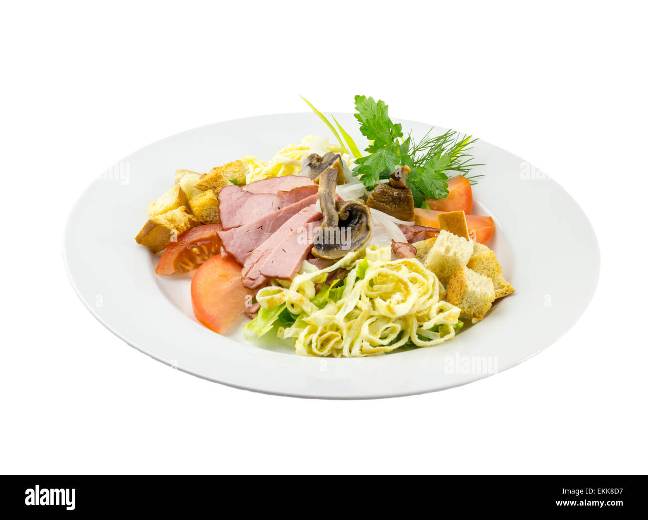 Beef salad with mushrooms and tomatoes on a dish with isolated backround Stock Photo