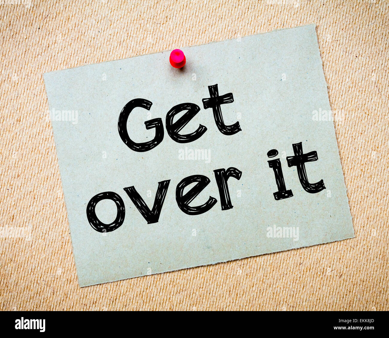 Get Over It Message. Recycled paper note pinned on cork board. Concept Image Stock Photo