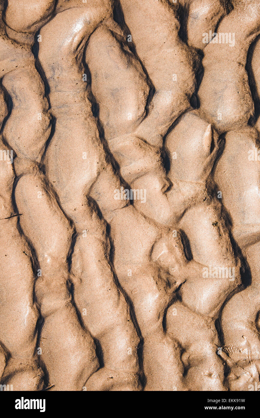 Beach with soft sand, rippled texture. Closeup shot. Stock Photo