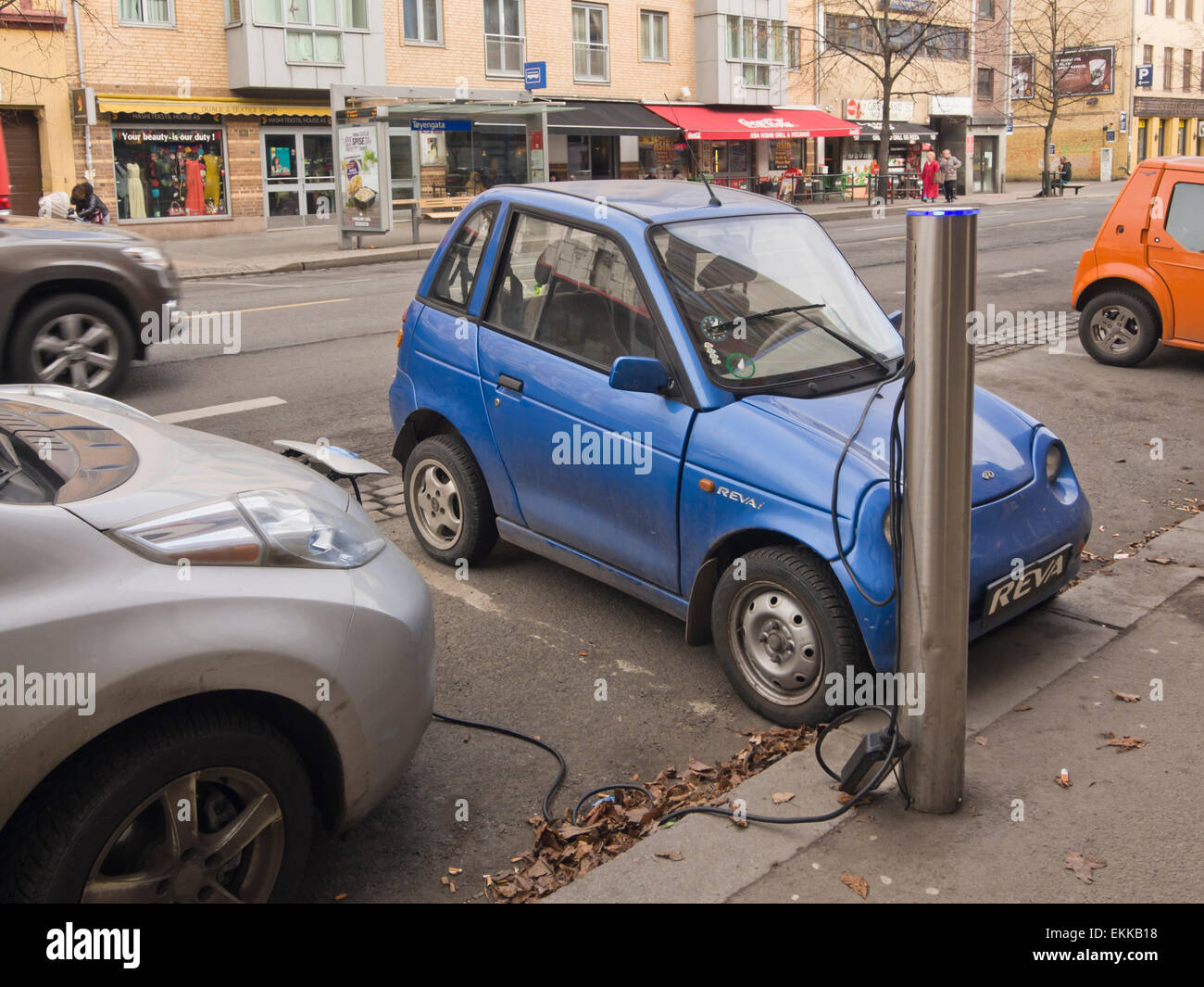 Charging electric cars in a public street parking in the center of Oslo