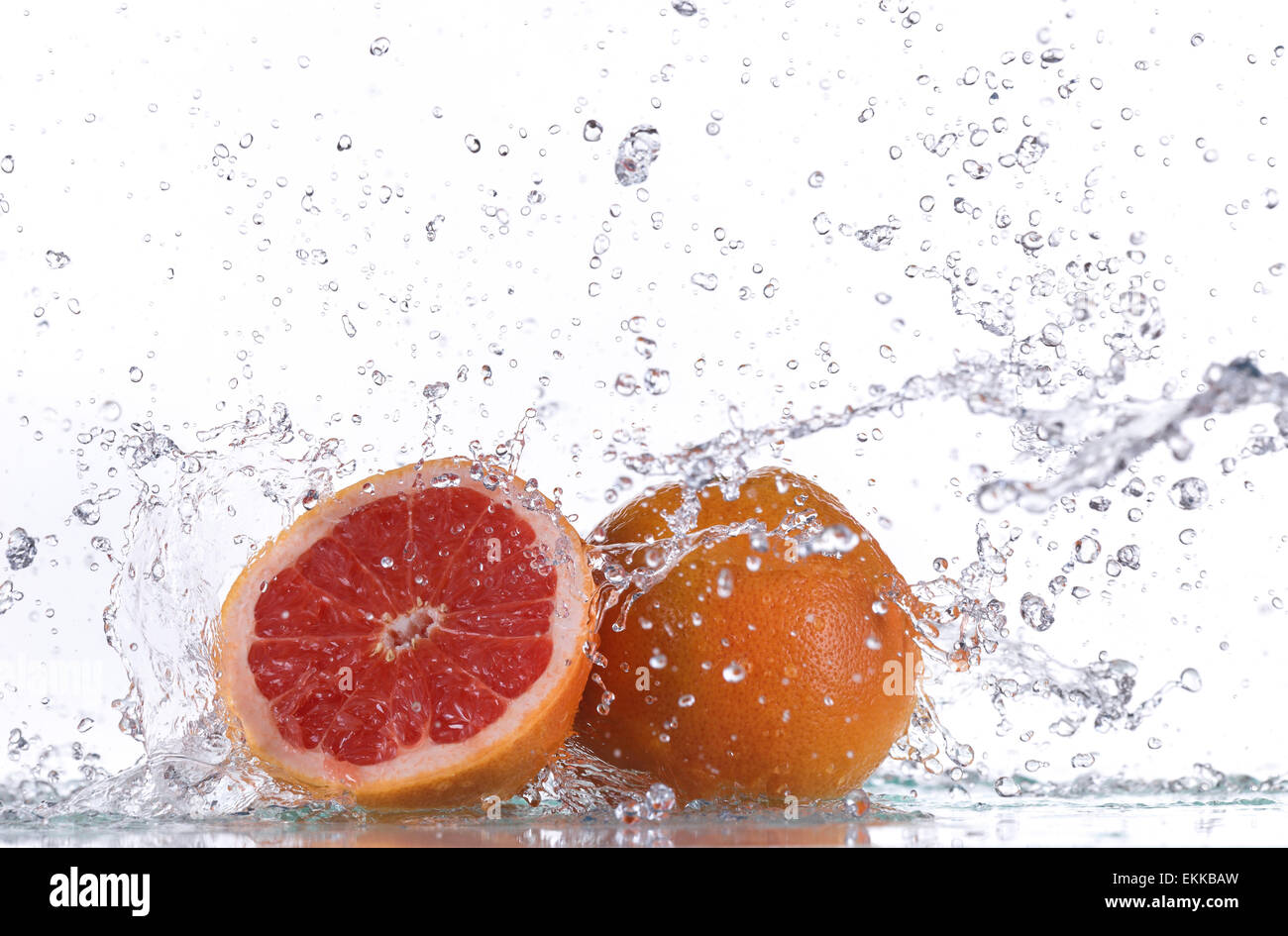 Grapefruit with water splash isolated on white Stock Photo Alamy