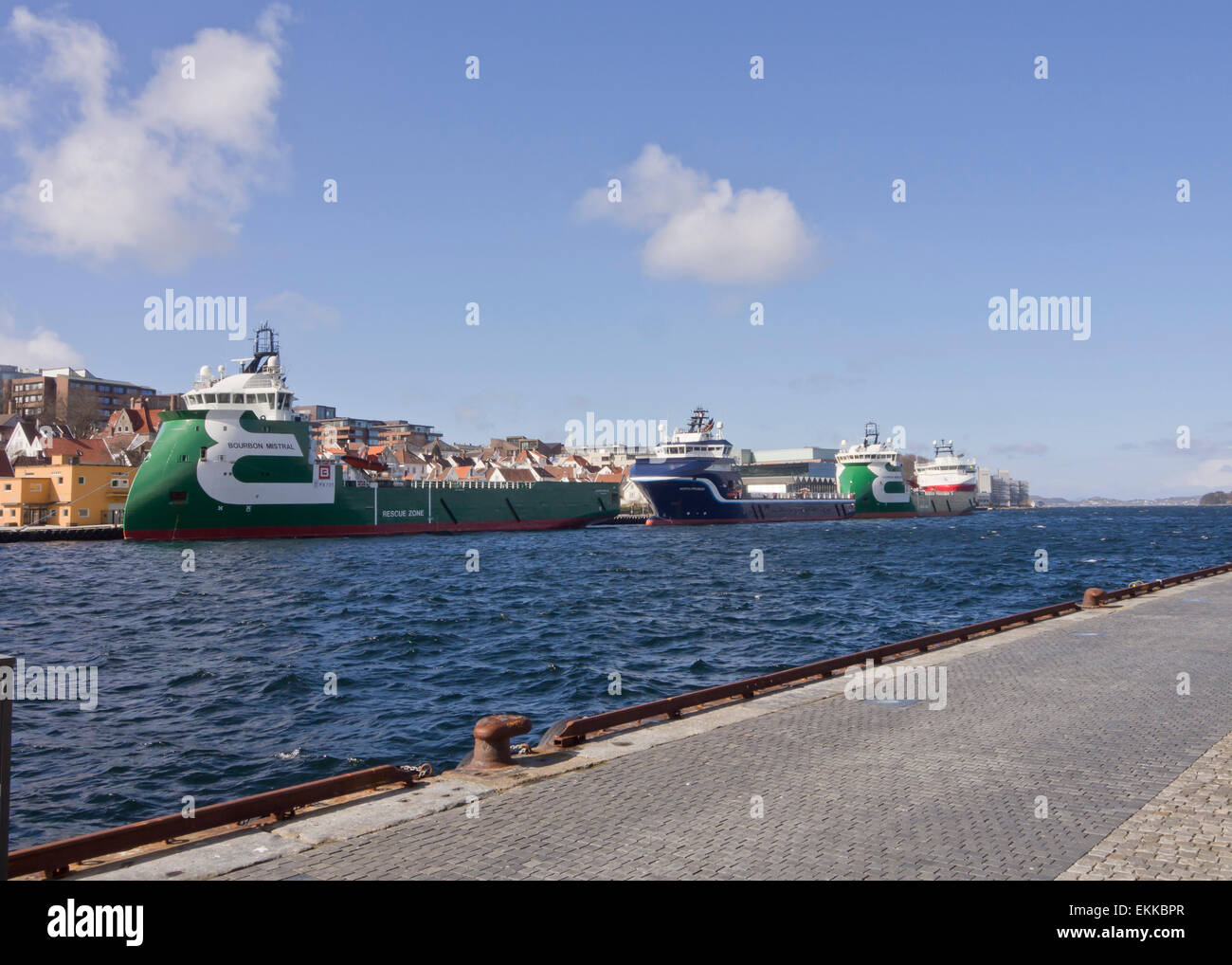 Stavanger harbour in the middle of the city has frequent visits by modern oil industry supply ships Stock Photo