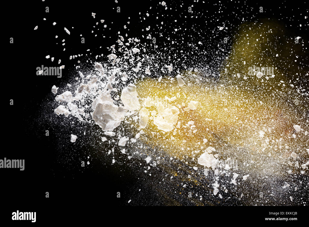Launched colorful powder, isolated on black background Stock Photo - Alamy