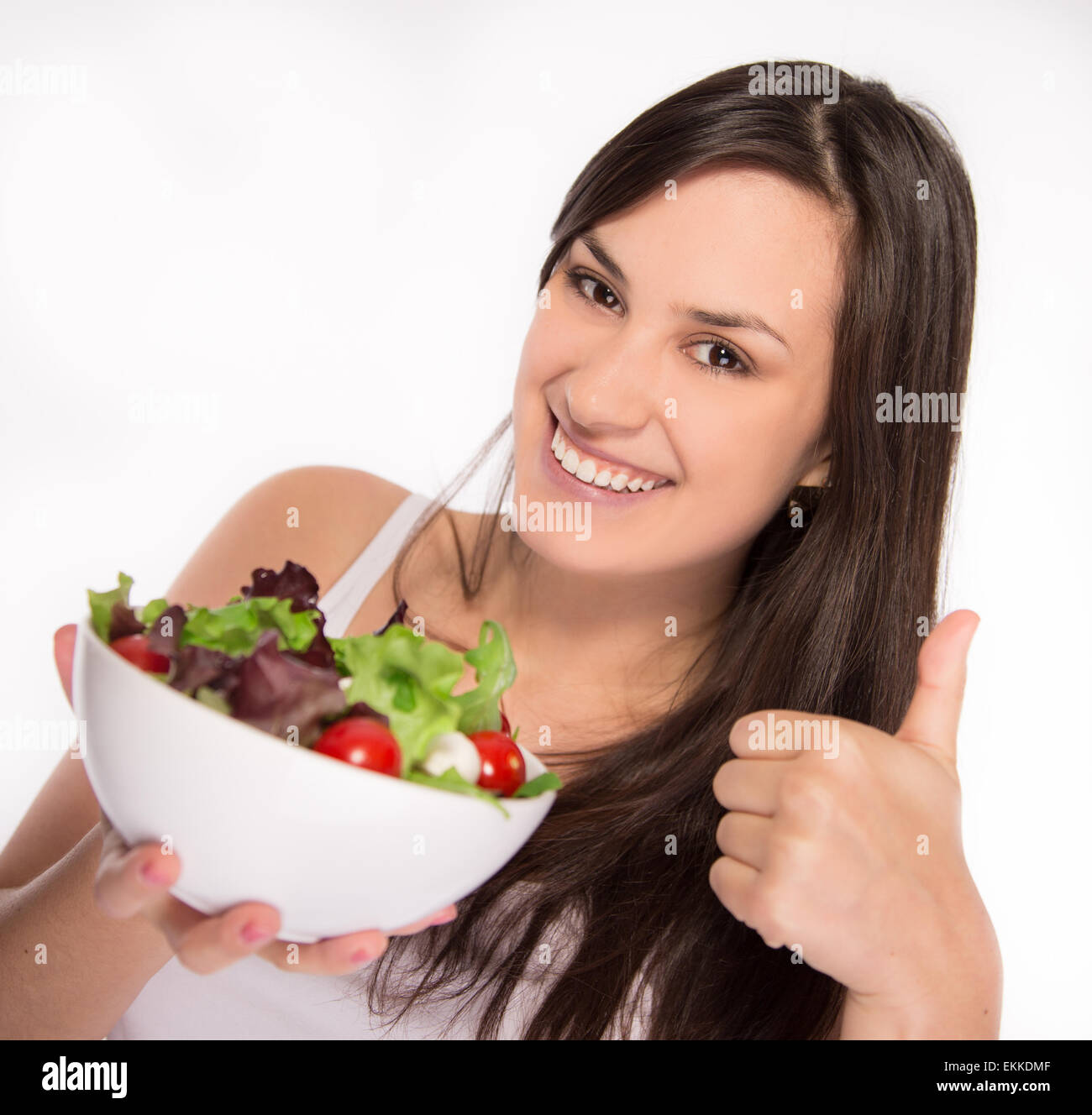 Portrait of attractive smiling woman eating salat Stock Photo - Alamy