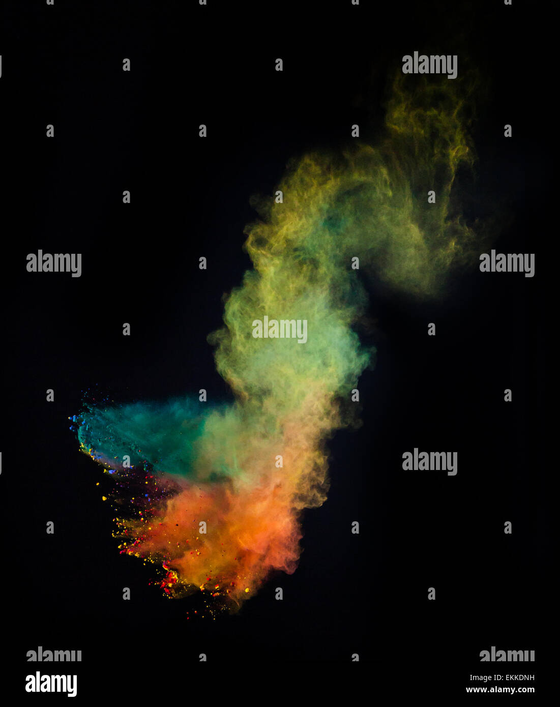 Launched colorful powder, isolated on black background Stock Photo - Alamy