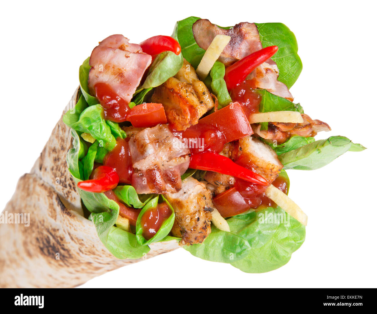 Chicken slices in a Tortilla Wrap with Lettuce over white. Stock Photo