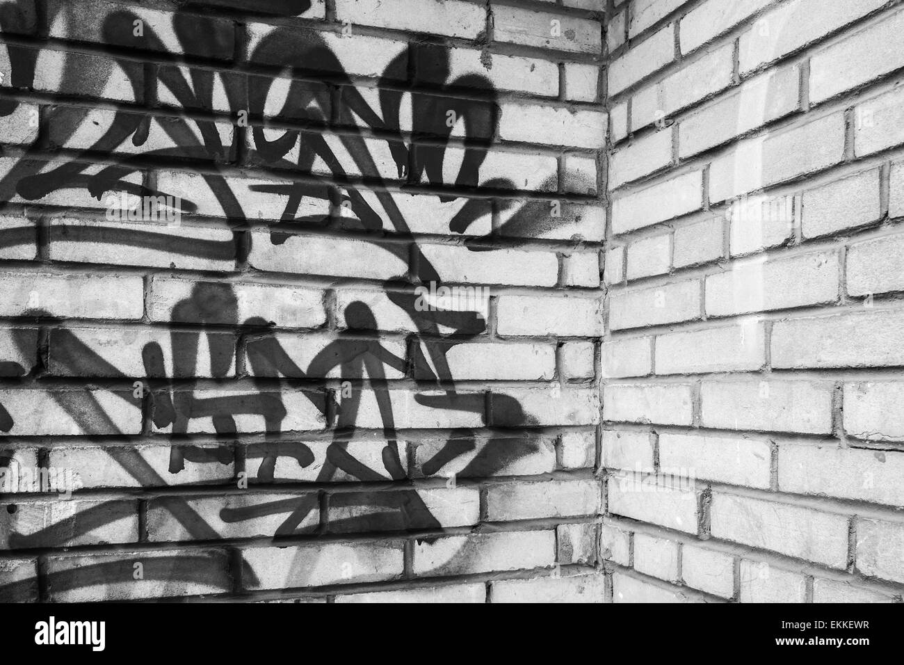 Abstract graffiti fragment on gray brick wall, empty urban interior fragment Stock Photo