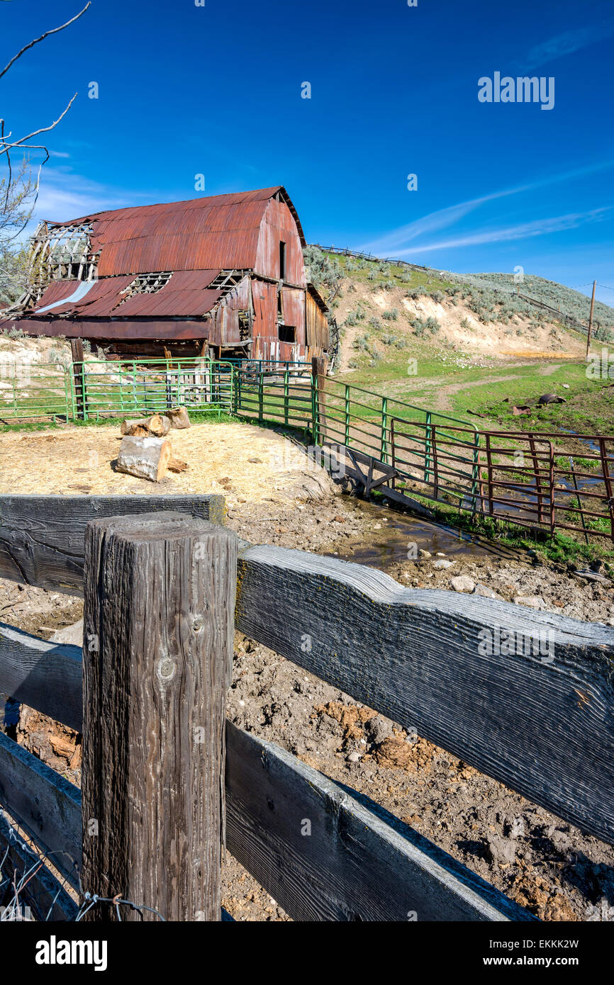 Rusty red barn and cattle corral Stock Photo