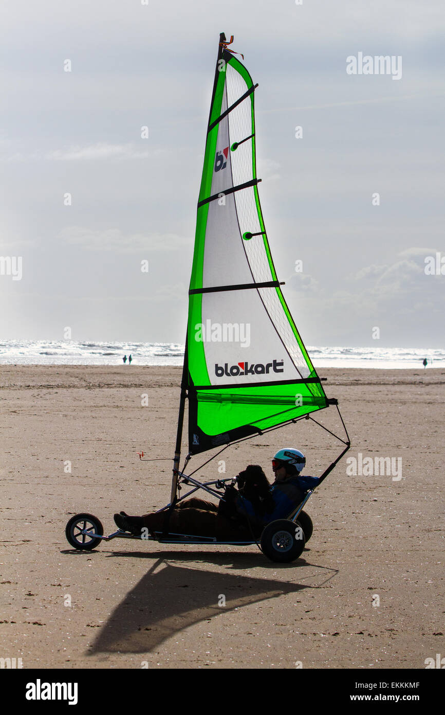 Southport, Merseyside, UK . 11th April, 2015.  Blokarting on Ainsdale Beach    Due to their small size and maneuverability, Blokarts are able to be sailed in small urban areas. They can be quickly disassembled and packed into a carry-bag giving them a high degree of portability.  Blokarts have hand steering (unlike most other land yachts) and require few sail adjustments which make them particularly easy to learn to sail. They are used for leisure sailing on beaches in many parts of the world. Stock Photo
