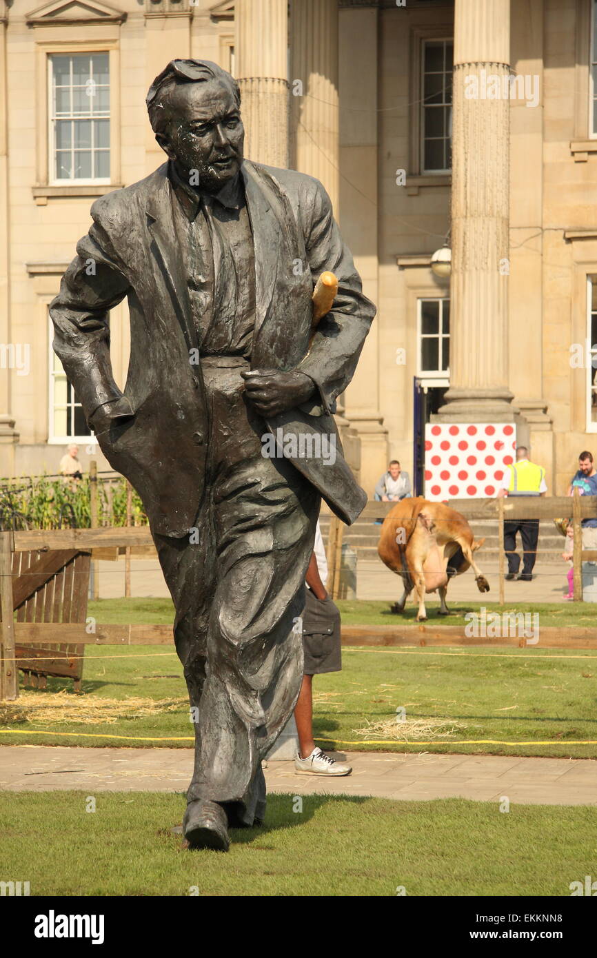 A statue of former British PM Harold Wilson, Huddersfield railway station sports a French baguette to mark the Tour de France Stock Photo