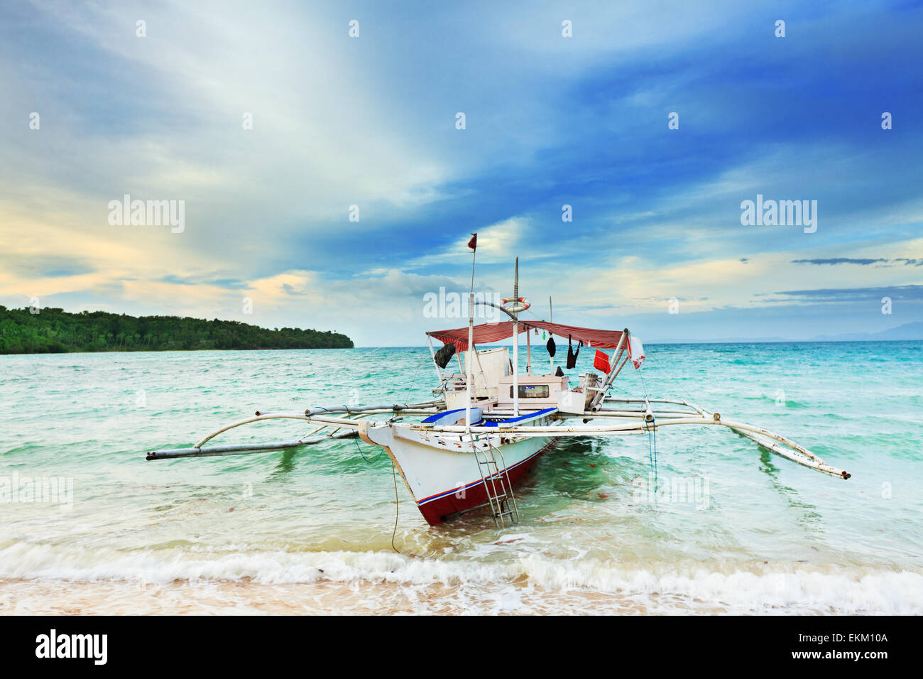 Traditional Philippine boat in the tropical lagoon Stock Photo