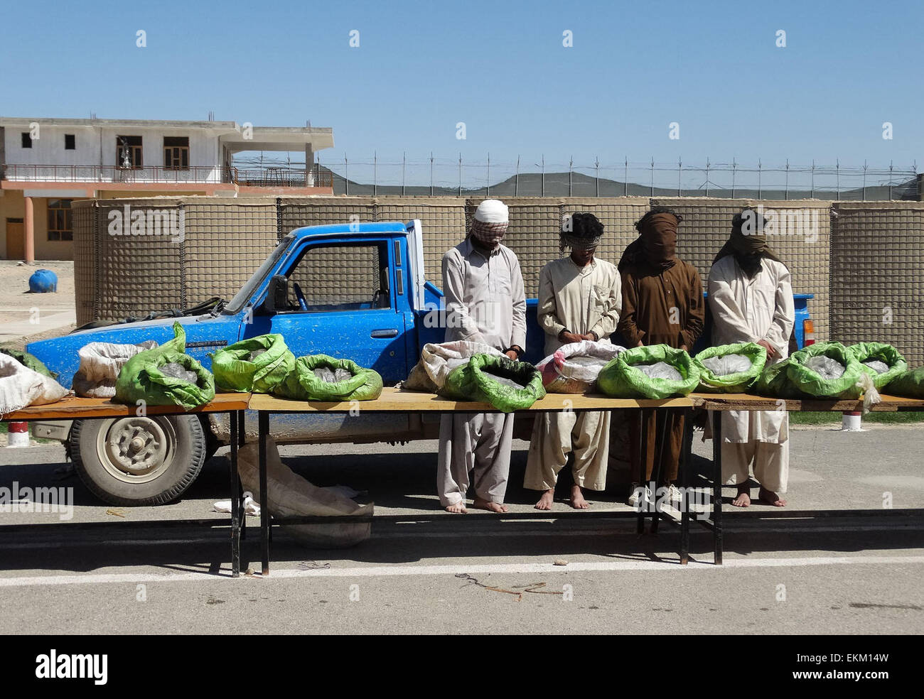 Helmand. 11th Apr, 2015. Taliban militants stand handcuffed after being captured with explosive devices by Afghan border police in Helmand province April 11, 2015. © Safdare/Xinhua/Alamy Live News Stock Photo