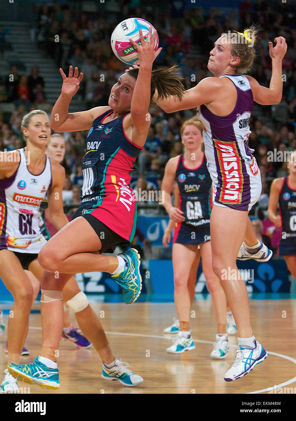 Melbourne, Victoria, Australia. 12th Apr, 2015. Vixen and Firebird players compete for the ball during the 2015 ANZ Championship Netball game between the Melbourne Vixens and the QLD Firebirds at Hisense Arena. The QLD Firebirds beat the Melbourne Vixens 55-48 Credit:  Tom Griffiths/ZUMA Wire/Alamy Live News Stock Photo