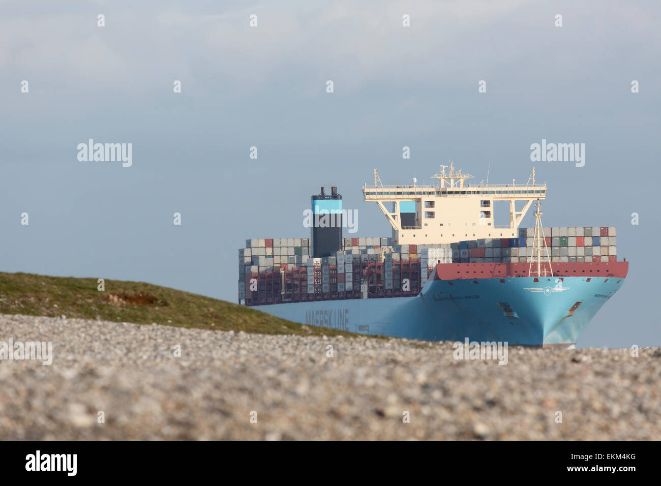 A huge Triple-E-container vessel from Maersk Line passes Sletterhage on its approach to Aarhus. Stock Photo