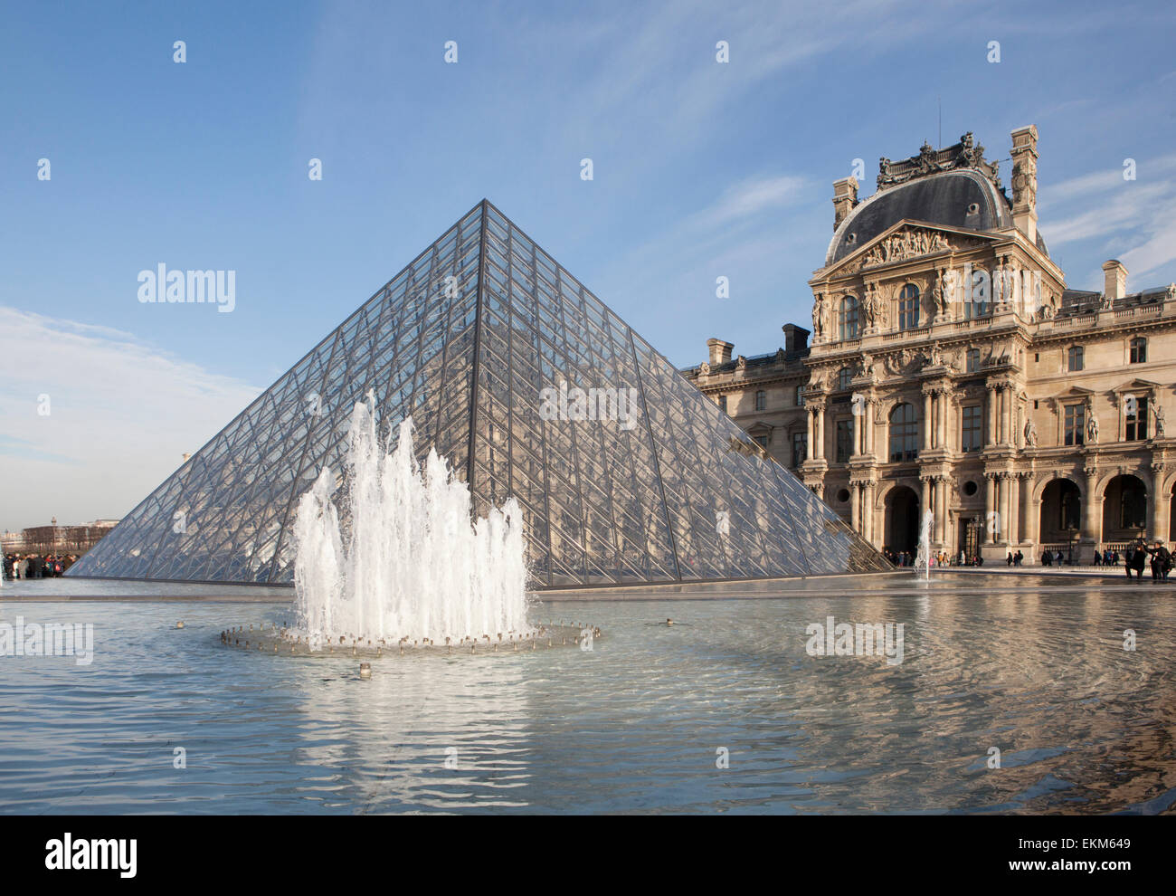 The Louvre Pyramid and Palace in Paris Stock Photo