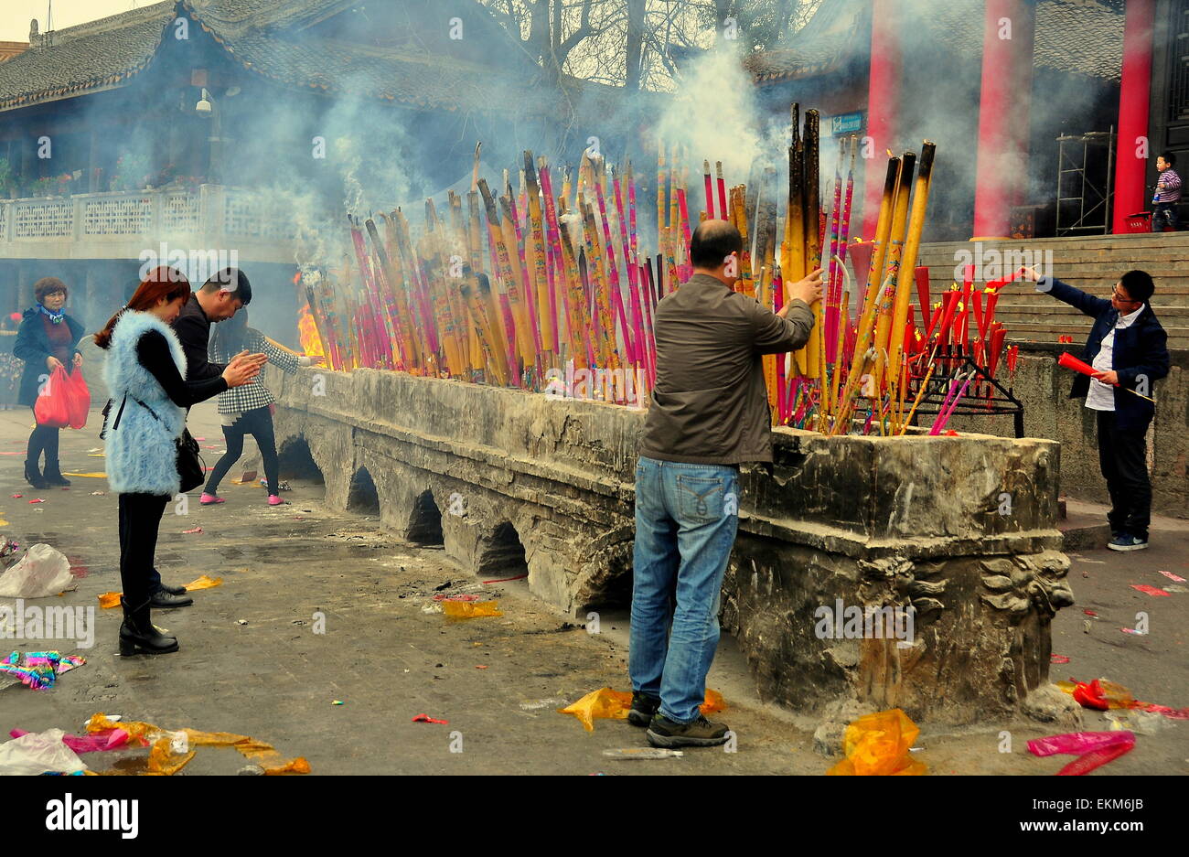 Sui Ning, China:  Chinese Buddhists lighting immense incense sticks and praying at the Lin Quan Si Temple  * Stock Photo