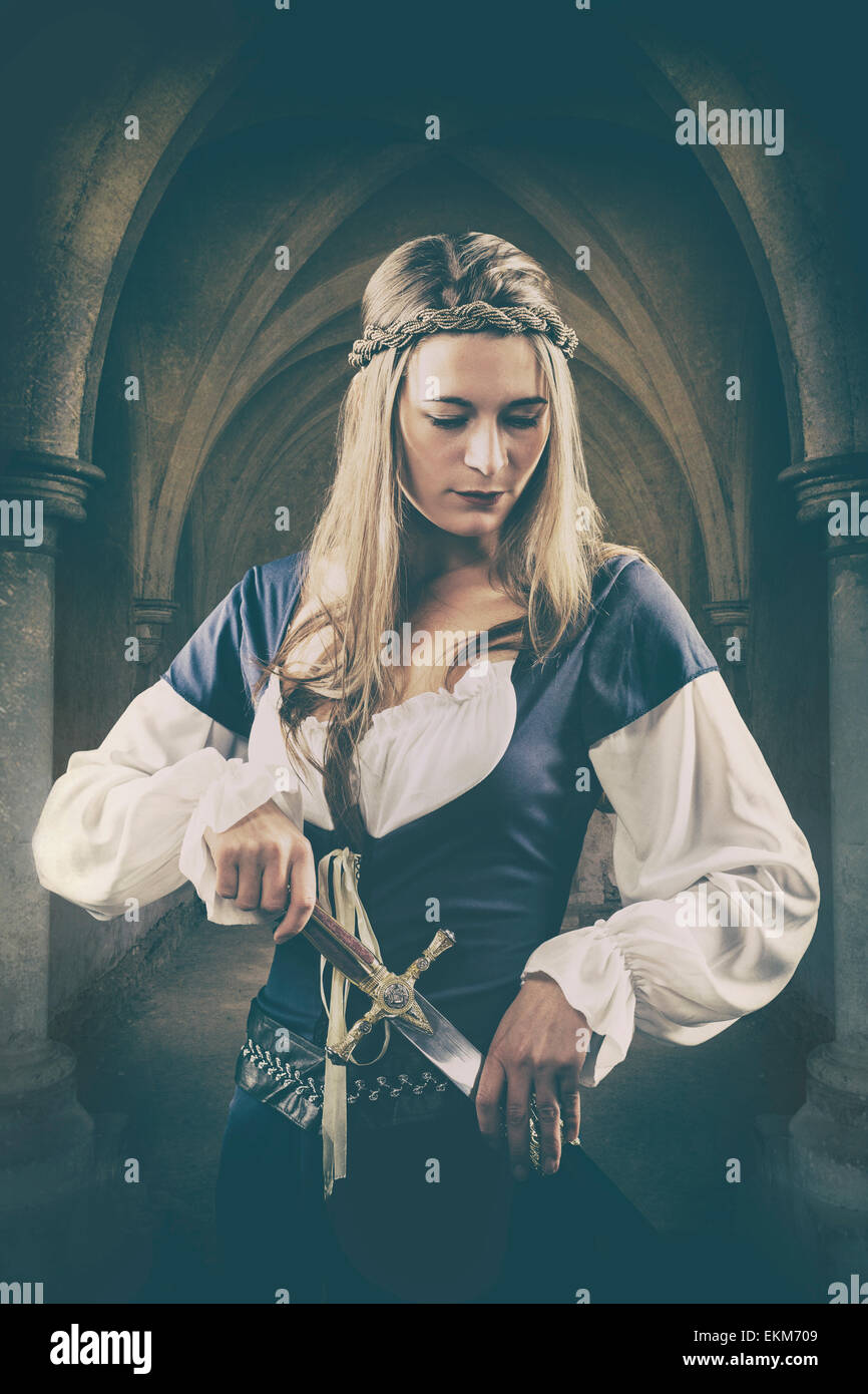 Medieval woman holding a dagger Stock Photo