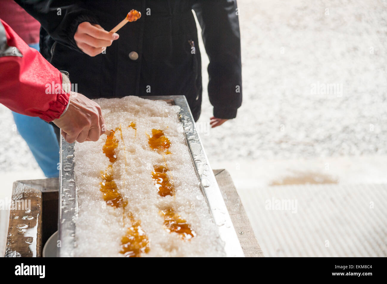 Maple taffy on snow during sugar shack period. In Quebec, Canada Stock