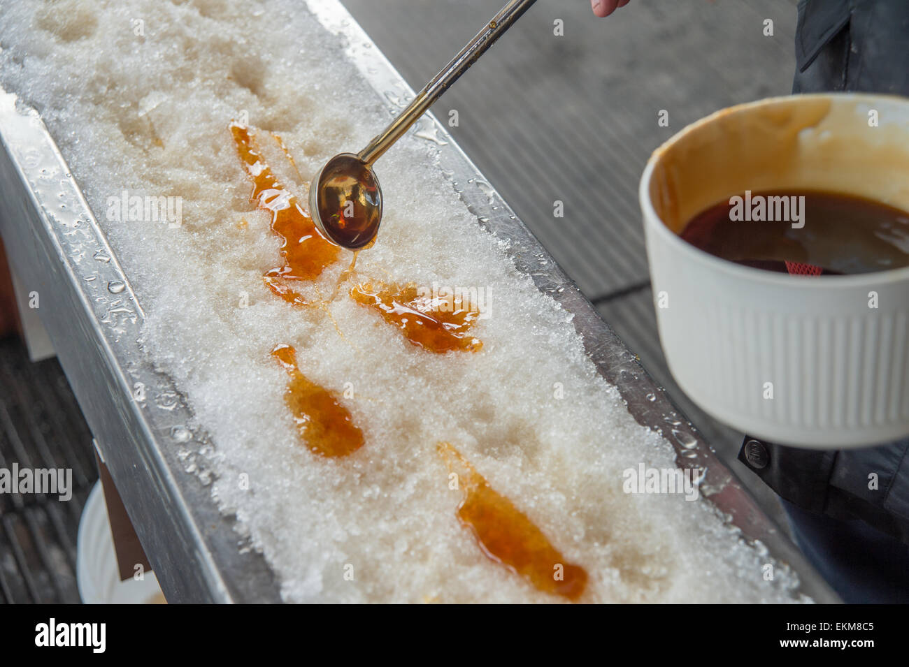 Maple taffy on snow during sugar shack period. In Quebec, Canada Stock