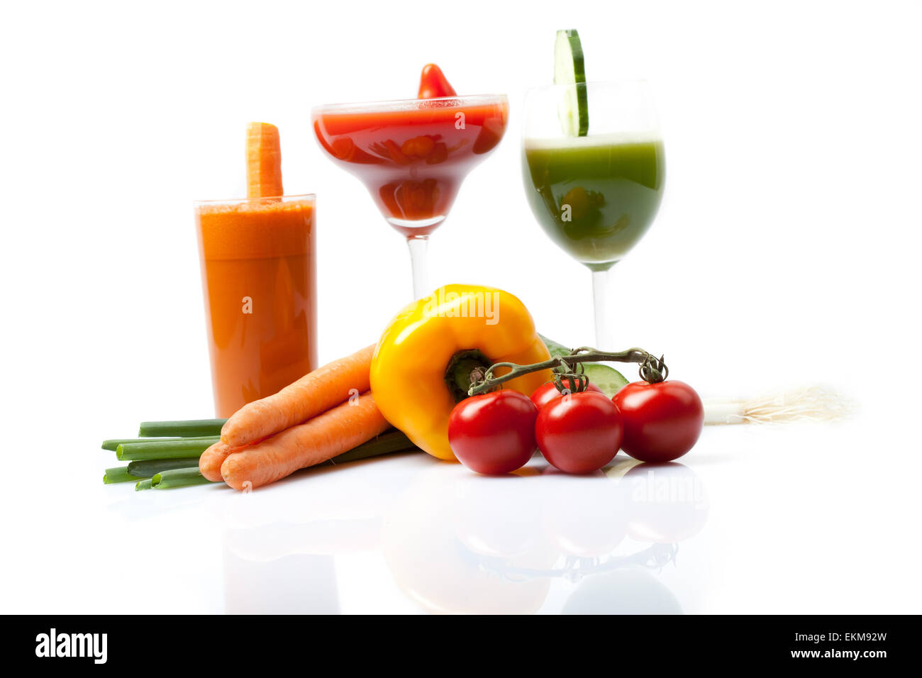 vegan smoothies on white background, carrot cucumber tomato juice Stock