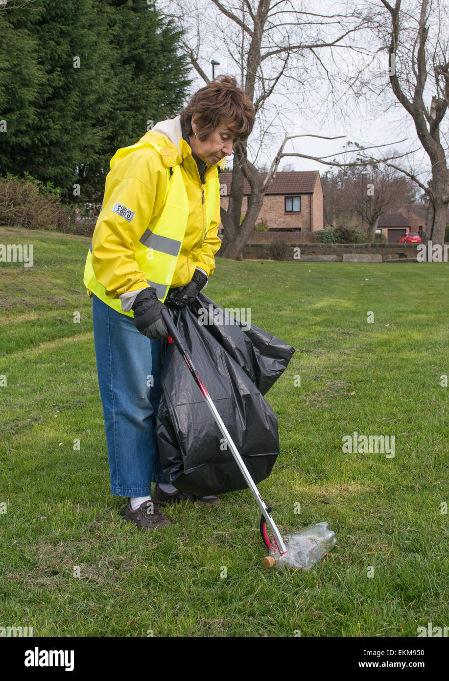 Woman community volunteer litter picker Washington, north east England, UK Stock Photo