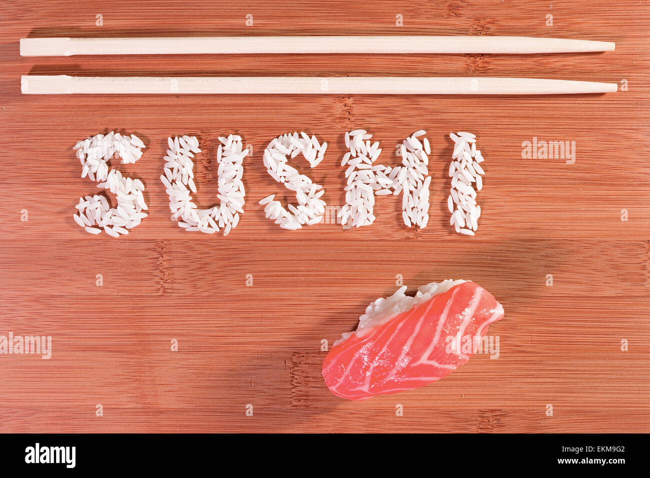 sushi and sushi rice written on bamboo with chopstick Stock Photo