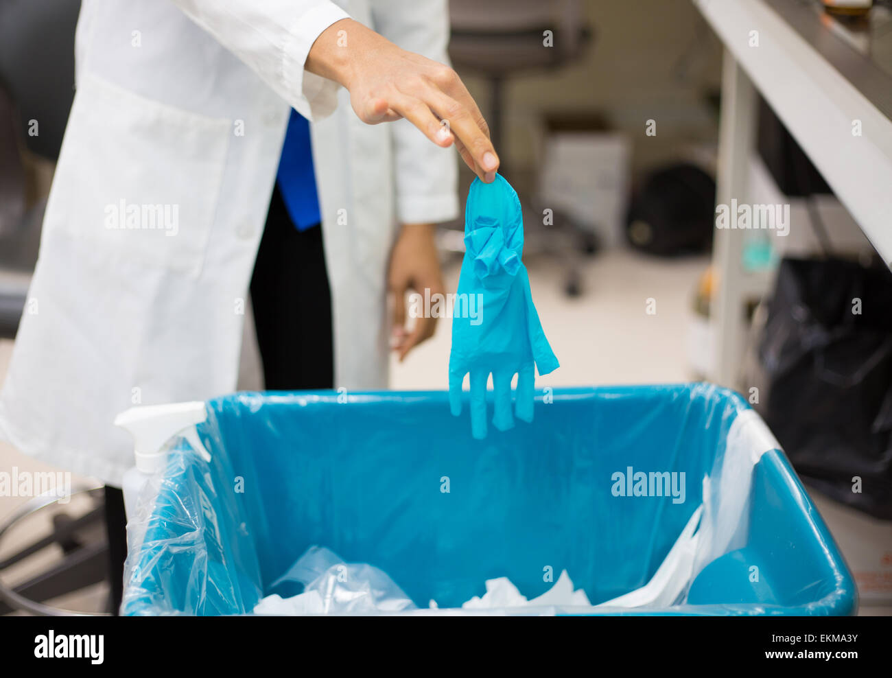 Closeup cropped portrait, healthcare professional throwing away blue
