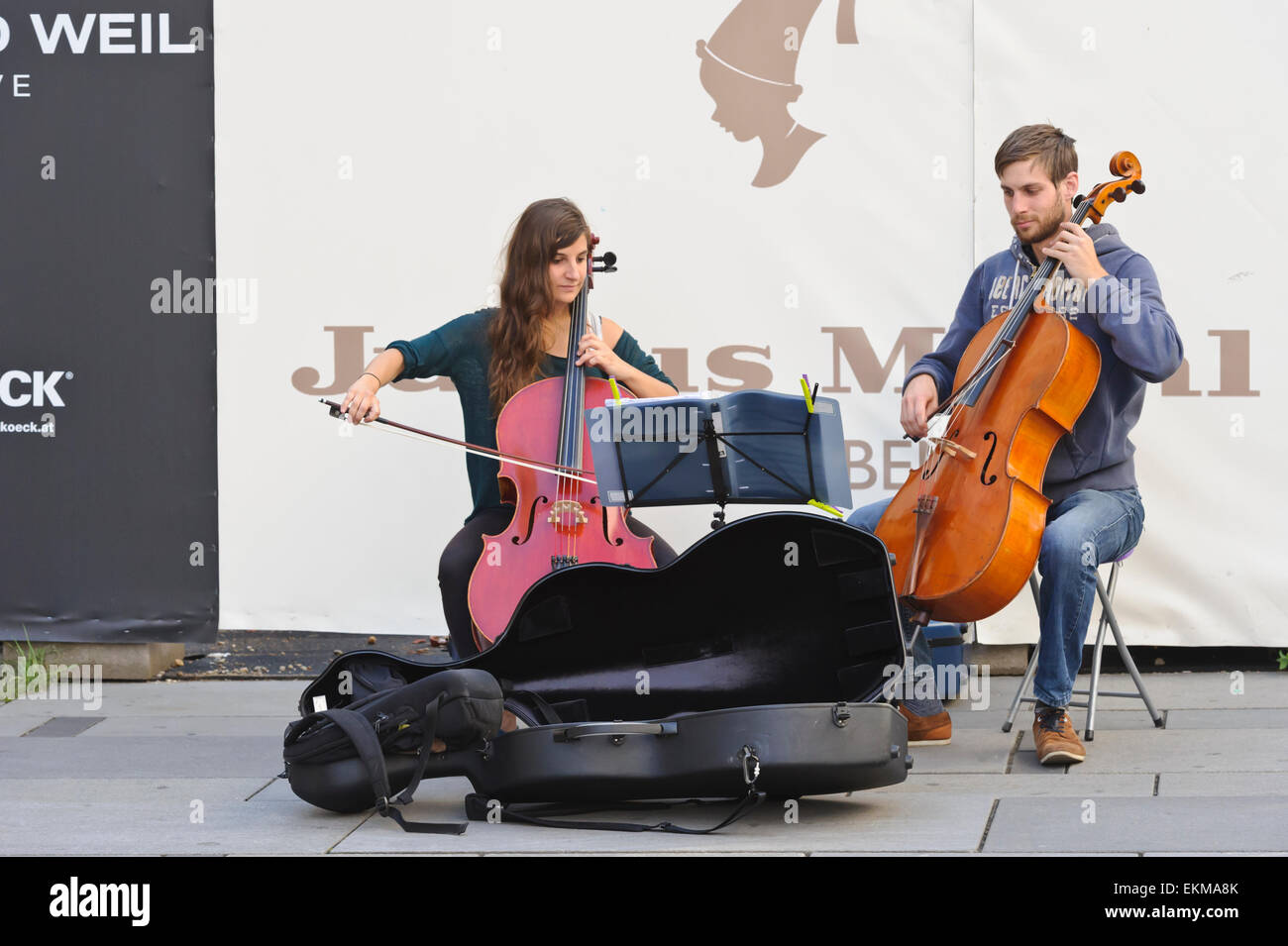 A couple playing classical music on cellos on the street of Vienna, Austria. Stock Photo