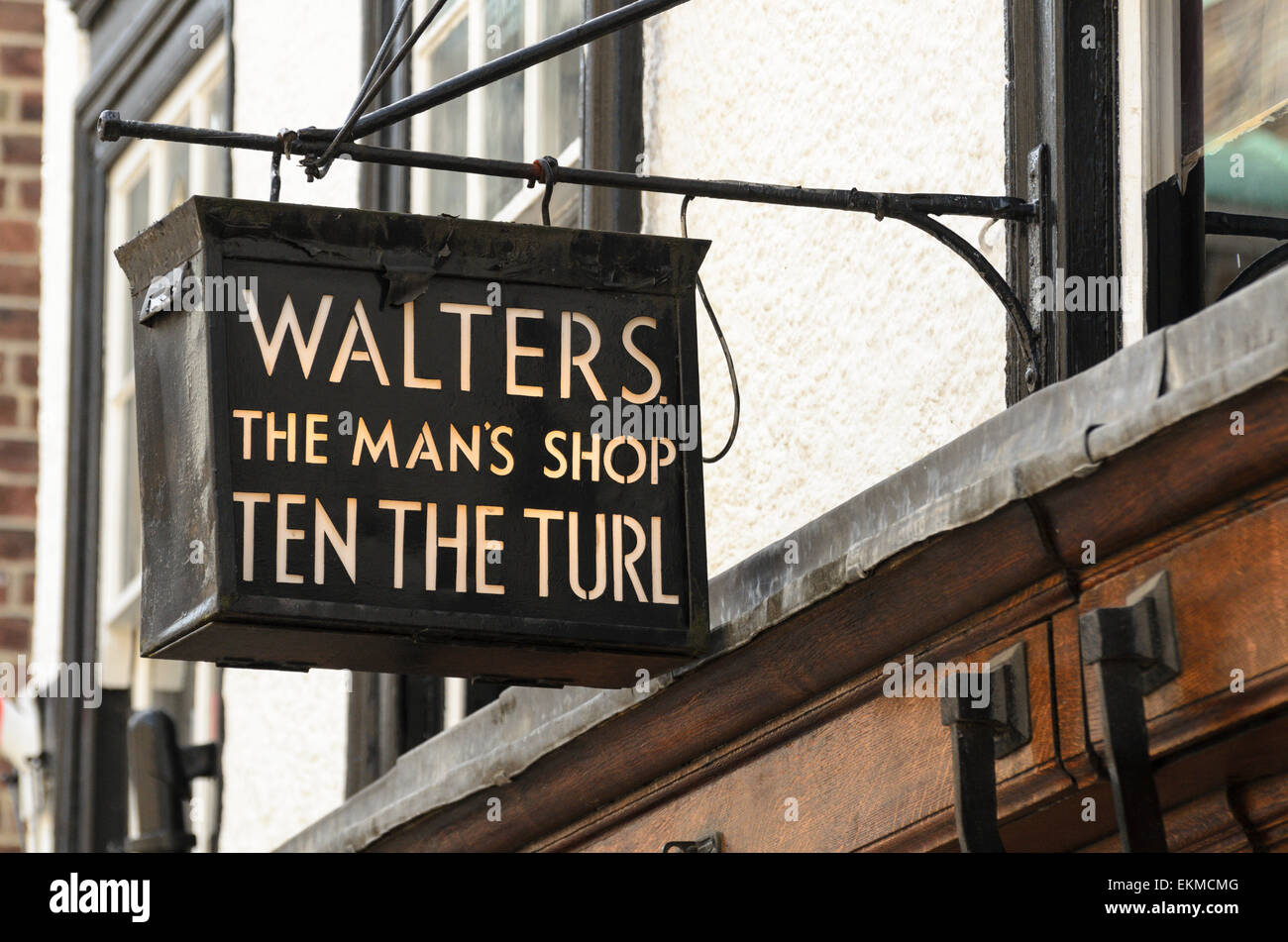 The illuminated sign of Walters, a menswear shop on Turl St, Oxford, UK ...