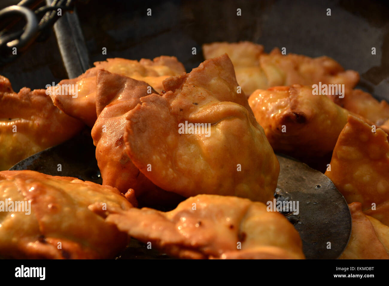 Deep fryed samosas right from hot oil or pan Stock Photo