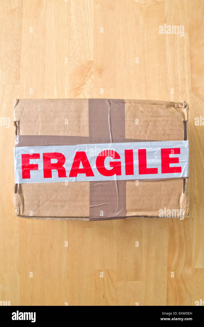 Cardboard Box Parcel With Fragile Packing Tape Stock Photo Alamy