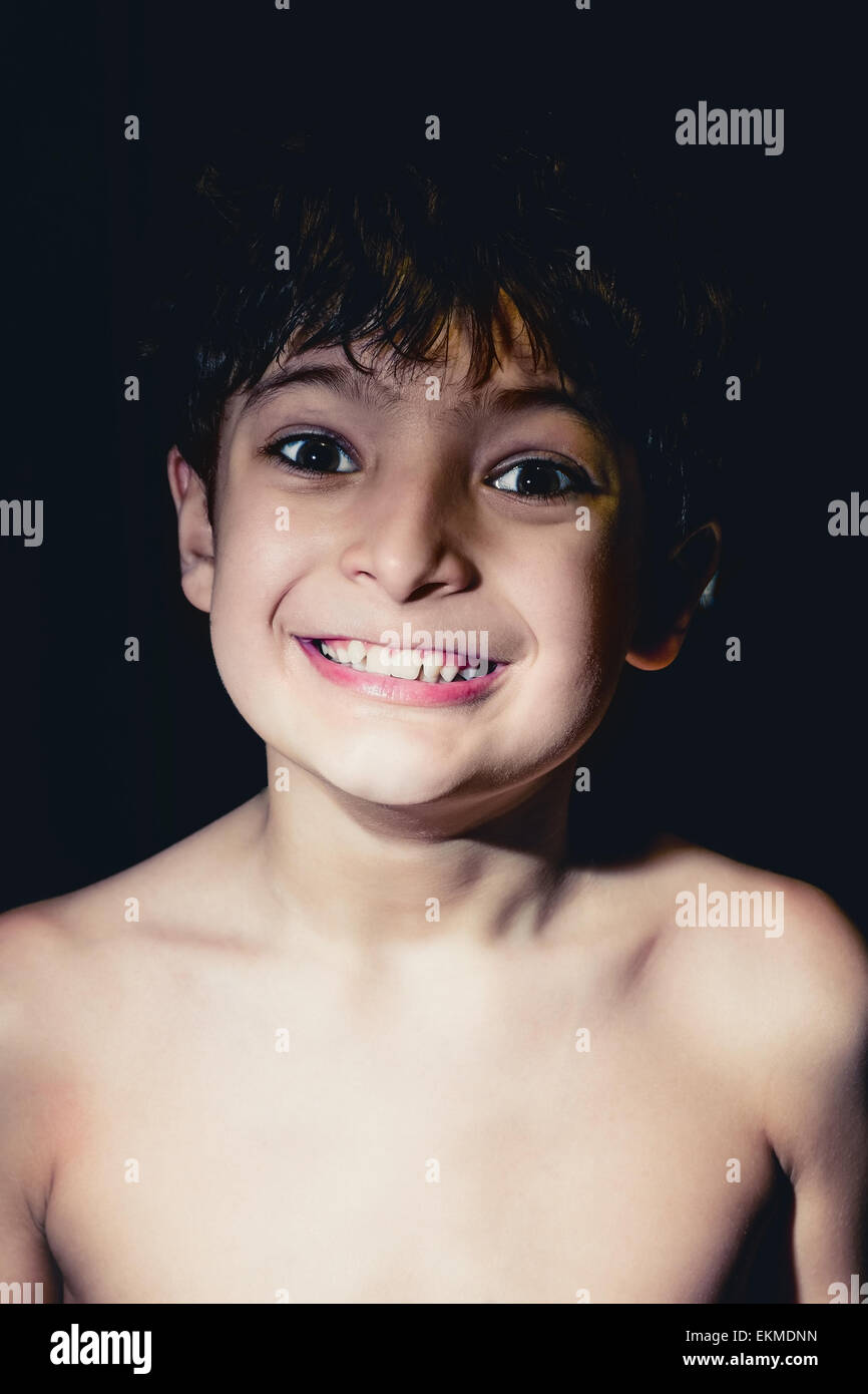 Smiling  boy in the dark toned colorized image Stock Photo