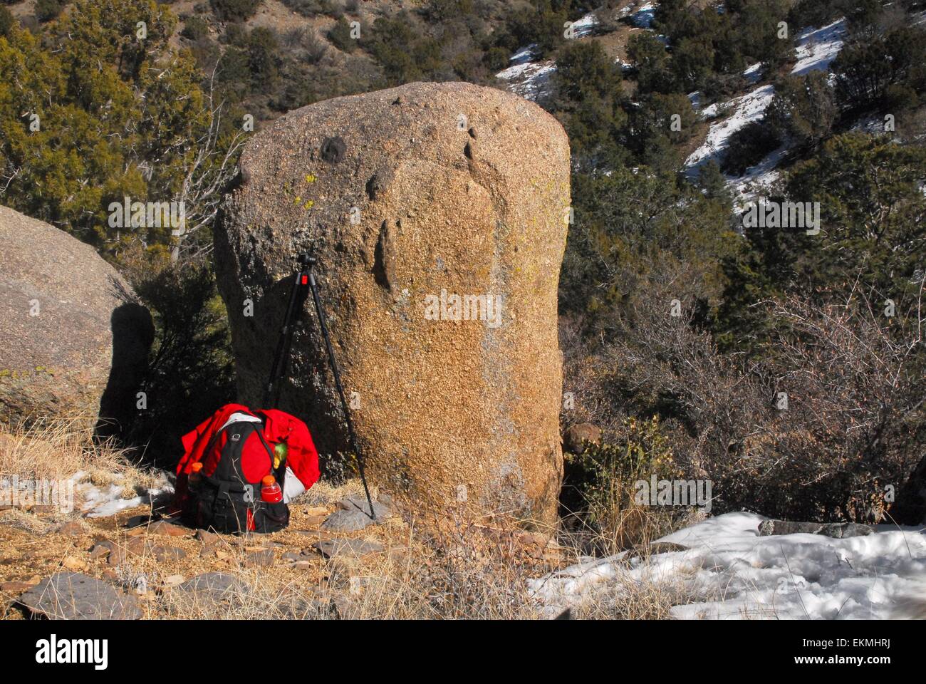 Day pack and tripod along trail Sandia Mountains of New Mexico - USA Stock Photo