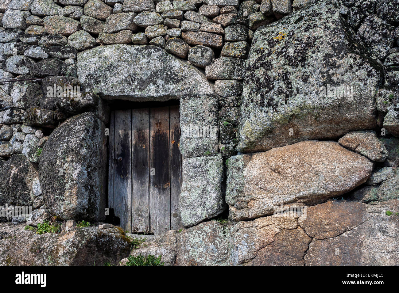 old stone house with wooden door Stock Photo - Alamy