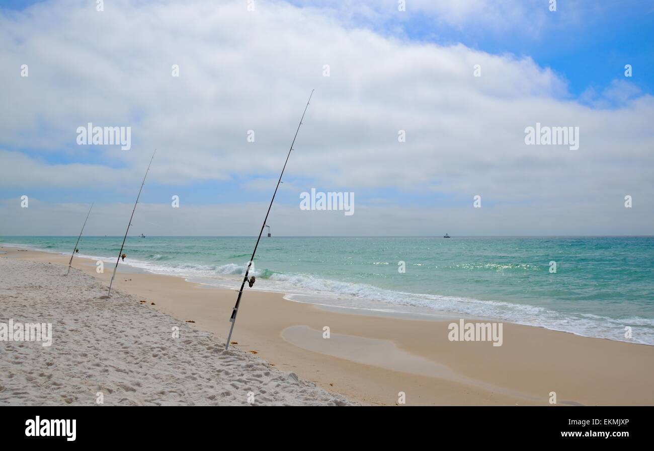 Fishing poles set in the white sands of Gulf of Mexico, Florida