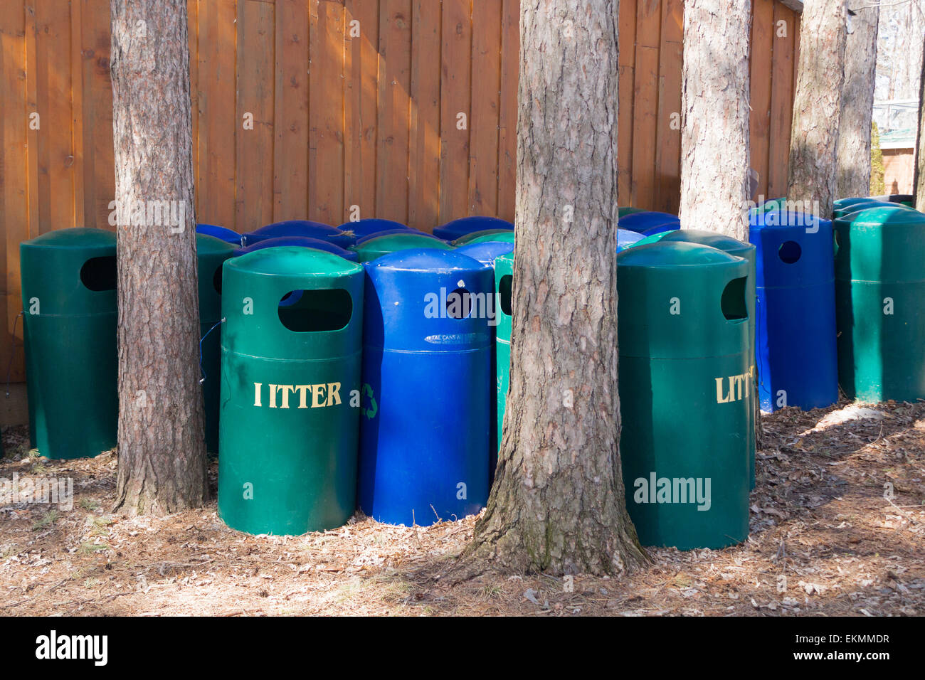 Litter and recycling bins stored behind a building at the Riverview Zoo