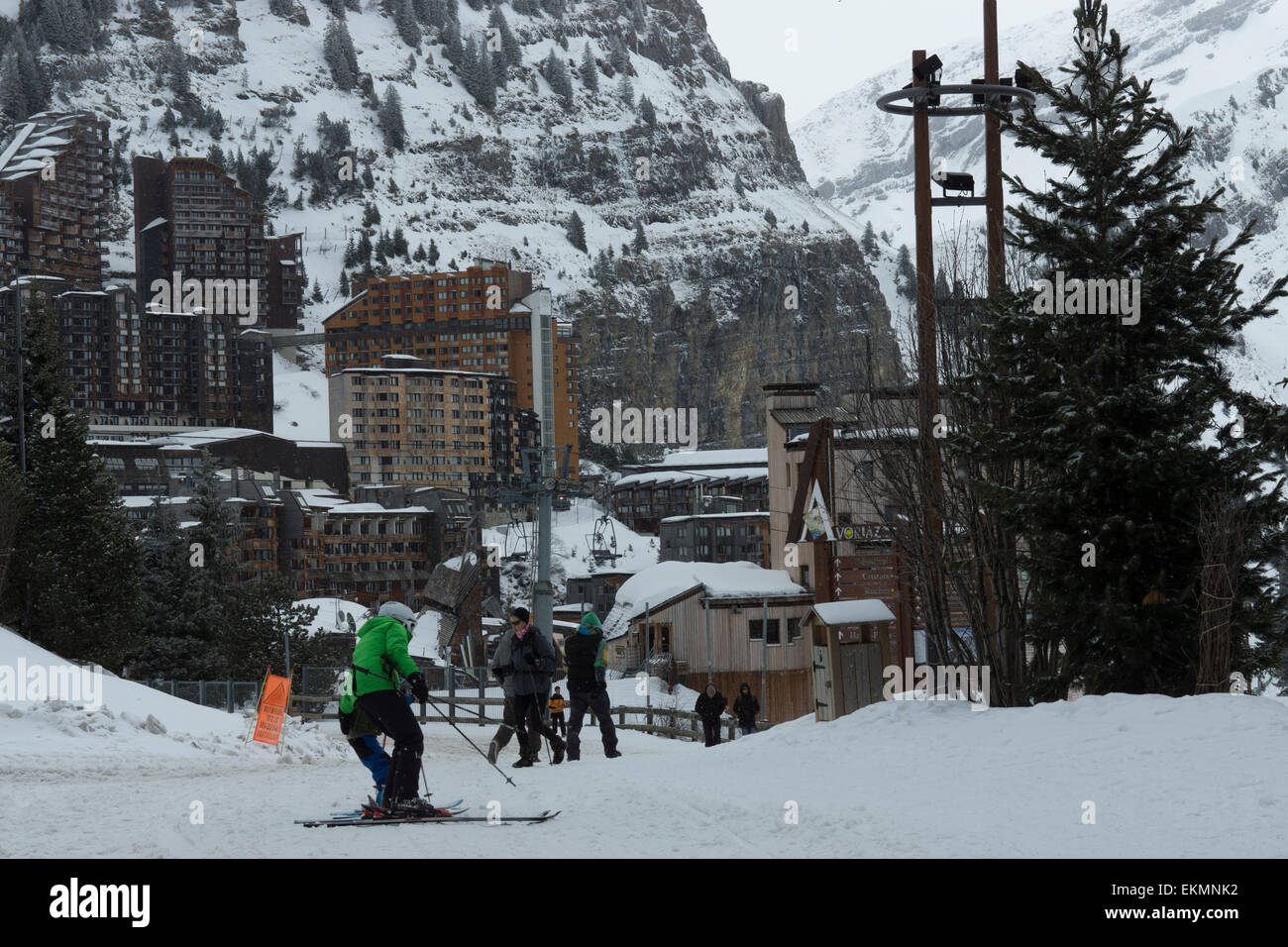 tourist skiing down snow coved path ski resort Stock Photo
